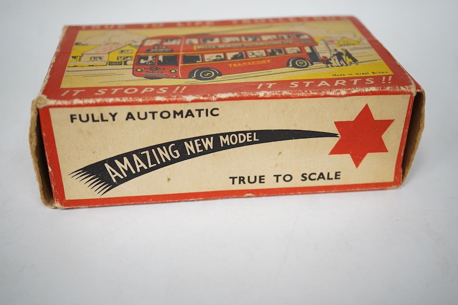 A boxed Wells Brimtoy tinplate clockwork trolley bus loosely in London Transport livery, together with three keys. Condition fair to good, clockwork motor appears to work correctly although has lost grip on the driving a